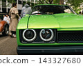 Green classic car headlights at Classic Days Berlin 143327680