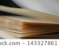 Open book showing pages, brown paper texture with abstract background, concept of education, knowledge, and wisdom 143327861