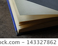 Open book pages revealing knowledge, education, learning, literature, and reading on a wooden background 143327862