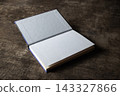Open notebook displaying blank white pages, representing education, ideas, and a fresh start for writing or drawing 143327866