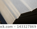Stack of old book pages, texture and edge detail creating a pattern for knowledge and literature concepts 143327869