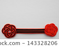 Flower-shaped decorations in Halloween's signature colors, white background, with space for copying. 143328206