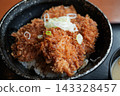 Japanese katsudon topped with green onions 143328457