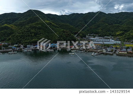 Aerial photograph capturing the fishing port and coastal settlements of Uwajima City, Ehime Prefecture. Aerial photograph capturing the fishing port and coastal settlements of Uwajima City, Ehime Prefecture. 143329554
