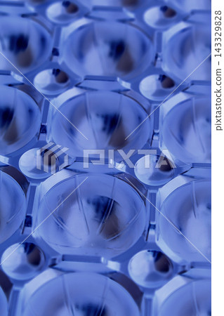 Futuristic background of spherical segments illuminated by diffused blue light Futuristic background of spherical segments illuminated by diffused blue light 143329828