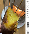 Roasted sweet potatoes on a stove 143330205