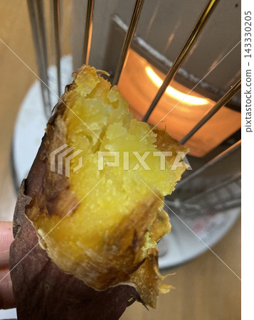 Roasted sweet potatoes on a stove Roasted sweet potatoes on a stove 143330205