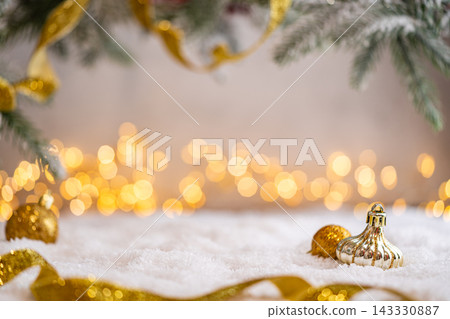 Gold Christmas Ornaments with Star and Ribbon on Snow Gold Christmas Ornaments with Star and Ribbon on Snow 143330887