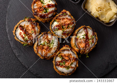 Hot tempura sushi rolls with tuna, rice, soy sauce, wasabi, and ginger. Hot tuna tempura roll Hot tempura sushi rolls with tuna, rice, soy sauce, wasabi, and ginger. Hot tuna tempura roll 143331667