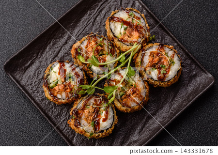 Hot tempura sushi rolls with tuna, rice, soy sauce, wasabi, and ginger. Hot tuna tempura roll Hot tempura sushi rolls with tuna, rice, soy sauce, wasabi, and ginger. Hot tuna tempura roll 143331678