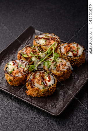 Hot tempura sushi rolls with tuna, rice, soy sauce, wasabi, and ginger. Hot tuna tempura roll Hot tempura sushi rolls with tuna, rice, soy sauce, wasabi, and ginger. Hot tuna tempura roll 143331679
