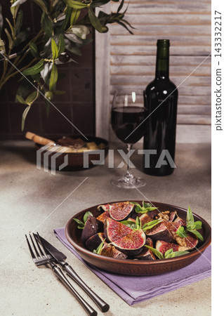 Fresh fig salad with wine, basil, and walnuts Fresh fig salad with wine, basil, and walnuts 143332217