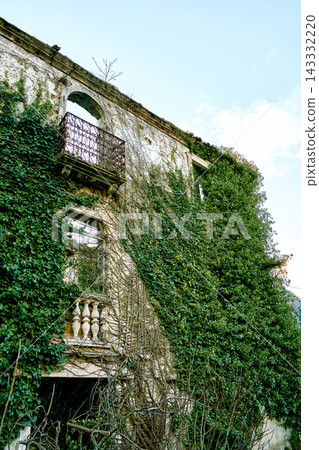 diagonal building angle view, multiple balconies stacked, iron railing upper level, stone balusters lower diagonal building angle view, multiple balconies stacked, iron railing upper level, stone balusters lower 143332220