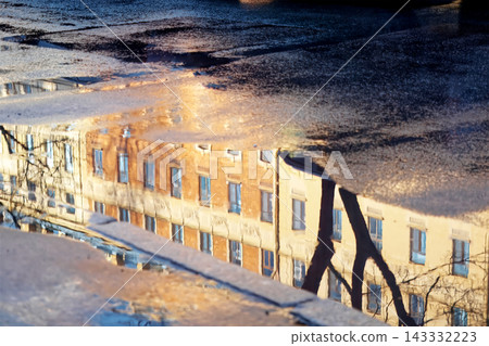 Reflection of Classical Architecture in a Rain Puddle on Asphalt Reflection of Classical Architecture in a Rain Puddle on Asphalt 143332223