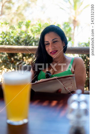 Beautiful Woman Reading Menu At Outdoor Restaurant Terrace Beautiful Woman Reading Menu At Outdoor Restaurant Terrace 143332380