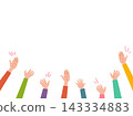 Several people in colorful clothing raise their hands 143334883