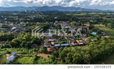 Aerial view of suburb area in Chiang Rai province, Thailand. This is the northernmost province in Thailand, famous for its rich Lanna history, mountain landscapes, and unique art landmarks. Aerial view of suburb area in Chiang Rai province, Thailand. This is the northernmost province in Thailand, famous for its rich Lanna history, mountain landscapes, and unique art landmarks. 143336335