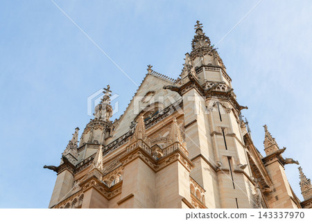 Gothic Spires and Gargoyles of Sainte-Chapelle Against Blue Sky, Medieval Architecture in Paris, France Gothic Spires and Gargoyles of Sainte-Chapelle Against Blue Sky, Medieval Architecture in Paris, France 143337970
