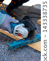 Worker cutting metal with many sharp sparks using equipments to cut iron 143338735