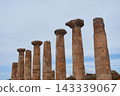 Stone columns of the ruined Temple of Heracles in the Valley of the Temples in Agrigento, Sicily, Italy 143339067