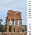 Doric columns of the Temple of the Dioscuri surrounded by nature in Agrigento, Sicily 143339368
