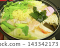 A piping hot pot dish of pork, vegetables, and noodles, a traditional Japanese winter home cooking dish. 143342173