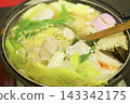 A piping hot pot dish of pork, vegetables, and noodles, a traditional Japanese winter home cooking dish. 143342175