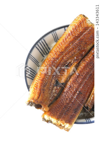 A single serving of eel rice bowl photographed against a white background. A single serving of eel rice bowl photographed against a white background. 143343611