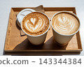 Two Lattes With Heart Latte Art In Paper Cups On Wooden Tray, Takeaway Coffee 143344384