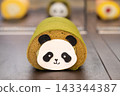 Cute Panda Roll Cake With Matcha Sponge and Cream Filling on Display 143344387
