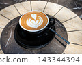 Beautifully crafted latte on a marble table 143344394