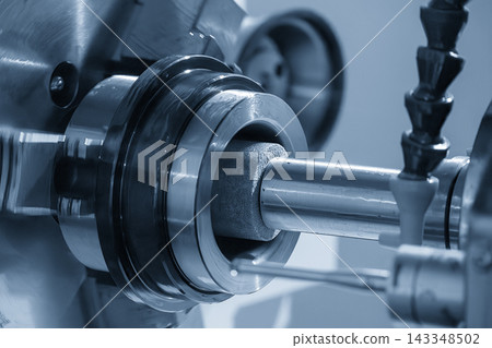 Internal surface finishing process of a high precision part by a grinding machine in a light blue scene Internal surface finishing process of a high precision part by a grinding machine in a light blue scene 143348502
