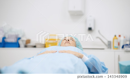 Female patient waiting for surgery in hospital room Female patient waiting for surgery in hospital room 143348909