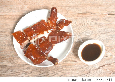 chop crispy skin fermenting with sesame roasted duck on plate dipping black sweet soy sauce chop crispy skin fermenting with sesame roasted duck on plate dipping black sweet soy sauce 143349611