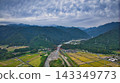 A scene from the Kurobe River alluvial fan in Toyama Prefecture during the rice harvest season. 143349773
