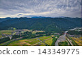 A scene from the Kurobe River alluvial fan in Toyama Prefecture during the rice harvest season. 143349775