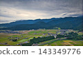 A scene from the Kurobe River alluvial fan in Toyama Prefecture during the rice harvest season. 143349776