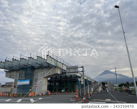 A viaduct and road construction project with a view of Mount Fuji. A viaduct and road construction project with a view of Mount Fuji. 143350470