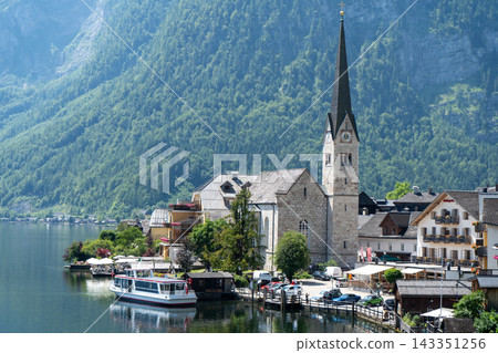 Nature Hallstatt Village on Lake Alpine Mountains and water waves in Austria. Old Church 143351256