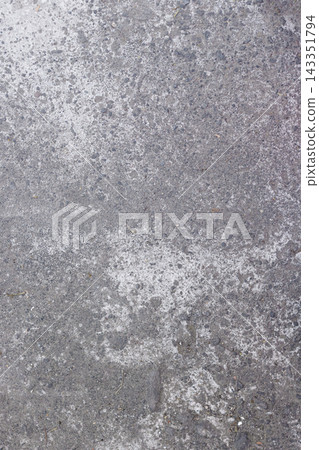 High angle view of a vertical weathered concrete pavement with rough texture, white discolored patches, and fine gravel details for graphic design backdrop. High Quality Photo High angle view of a vertical weathered concrete pavement with rough texture, white discolored patches, and fine gravel details for graphic design backdrop. High Quality Photo 143351794
