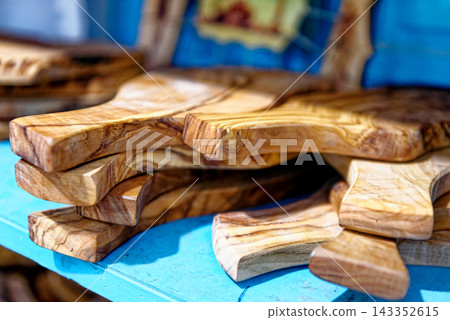 Stacked Handcrafted Olive Wood Cutting Boards in a Tunisian Bazaar Stacked Handcrafted Olive Wood Cutting Boards in a Tunisian Bazaar 143352615