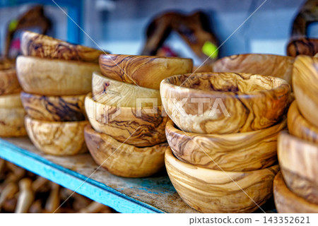 Stacked Handcrafted Olive Wood Salad Bowls in a Tunisian Market Shop Stacked Handcrafted Olive Wood Salad Bowls in a Tunisian Market Shop 143352621