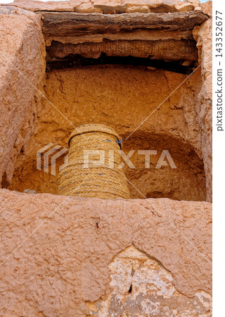 Traditional Woven Straw Hive or Basket Placed inside Carved Wall Alcove of Earth Dwelling Traditional Woven Straw Hive or Basket Placed inside Carved Wall Alcove of Earth Dwelling 143352677