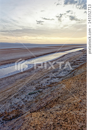 Diagonal Perspective Photograph of Saline Water Pools Cutting Across Chott el Djerid Salt Flat Diagonal Perspective Photograph of Saline Water Pools Cutting Across Chott el Djerid Salt Flat 143352713