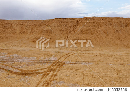 Desert Canyon and Salt Flat Plains Under Dramatic Stormy Sky Desert Canyon and Salt Flat Plains Under Dramatic Stormy Sky 143352738
