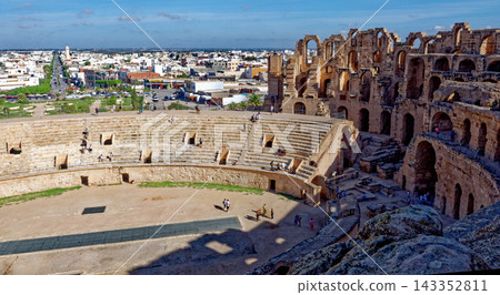Overview of Ancient El Jem Amphitheatre Arena and Scaffolding with Sprawling Town Skyline 143352811