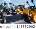 Row of brand new tractors and bulldozers for sale 143352992