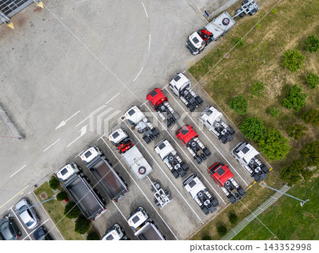 Aerial view of a large fleet of new commercial trucks at a dealership Aerial view of a large fleet of new commercial trucks at a dealership 143352998