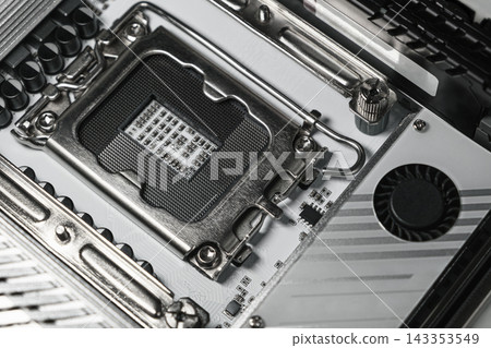 Close up of a CPU socket on a modern computer motherboard Close up of a CPU socket on a modern computer motherboard 143353549