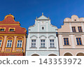 Telc Zacharias Square. Front view of the three colorful Baroque houses. 143353972